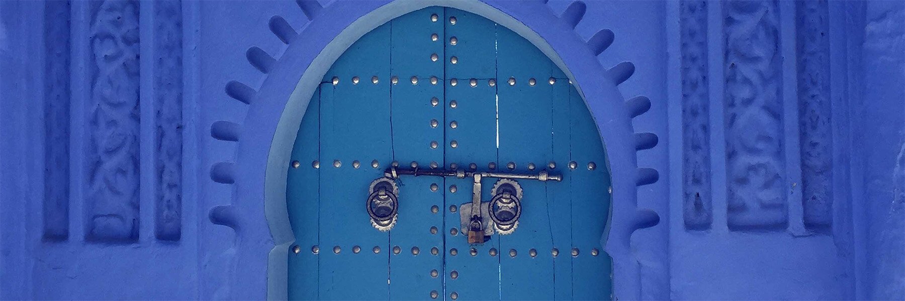 Blue door way with a locked door
